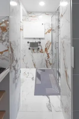 a bathroom with a glass shower with a sink at Rooms Nonna Bled in Bled