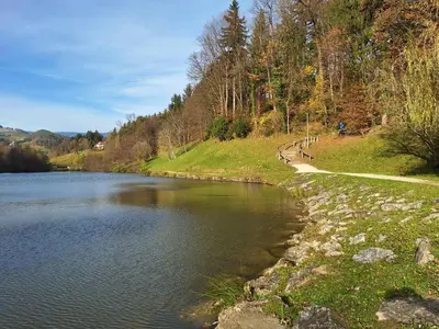 a body of water with a path next to it at Mia's room in Zreče