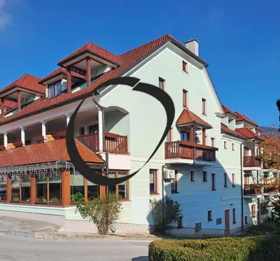 a building with a large sculpture in front of it at Mia's room in Zreče