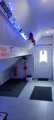a room with a white room with a door at Flegarrooms in Cerklje na Gorenjskem