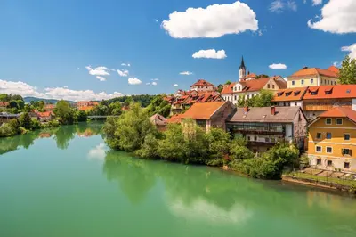 a view of a river with buildings and a town at Holiday home in Trzisce - Kranjska (Krain) 54981