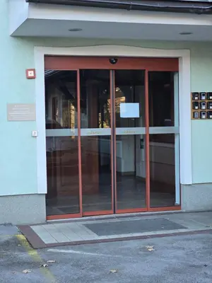 an entrance to a building with glass doors at Cozy Nook Stays, Ski rent, med Roglo in Termami Zreče, in Zreče