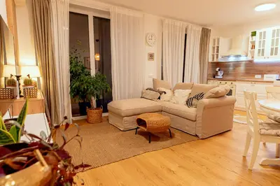 a living room with a couch and a table at Anur Apartment II in Ptuj
