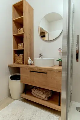 a bathroom with a sink and a mirror at Anur Apartment II in Ptuj