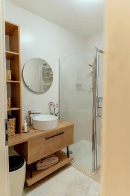 a bathroom with a sink and a shower at Anur Apartment II in Ptuj