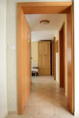 a hallway with a door leading into a room at Ekološka turistična kmetija pri Lovrču in Tolmin