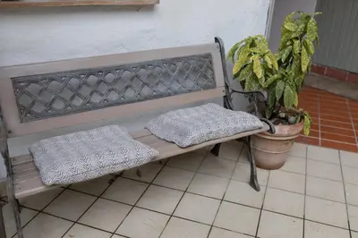 a bench sitting next to a potted plant at Elegant Castle Nook in Ljubljana