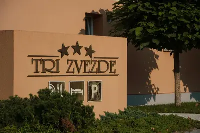 a sign for a hotel with stars on it at Guest House Tri Zvezde in Kočevje