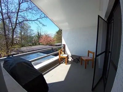 a view of a swimming pool from the balcony of a house at House Godec in Ljubljana