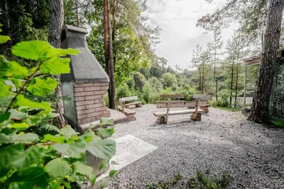 a picnic area with a bench and a picnic table at LYNX PRO - Basecamp units in Rove
