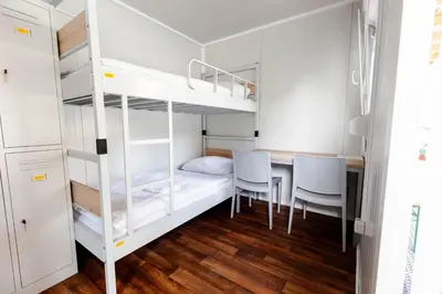 a bedroom with a bunk bed and a table and chairs at LYNX PRO - Basecamp units in Rove