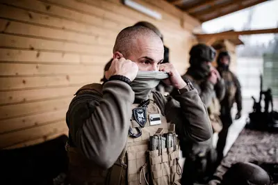 a man standing in a room with his hands on his face at LYNX PRO - Basecamp units in Rove