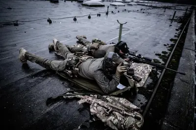 a man laying on the ground with a gun at LYNX PRO - Basecamp units in Rove