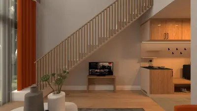 a living room with a staircase and a tv at Butični gorski spa hotel Rimski vrelec in Kotlje