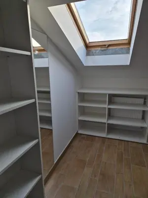 a skylight in a room with a closet at Apartment Doroteja in Podplat