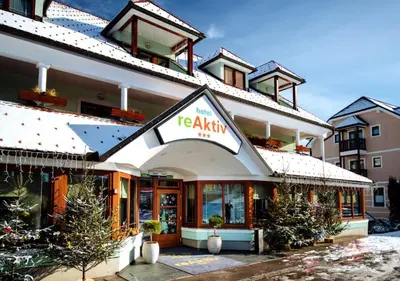 a hotel with a sign on the front of it at Apartma Roglina in Zreče