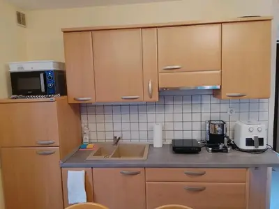 a kitchen with a sink and a counter top at Julijana's Holiday Home in Brežice