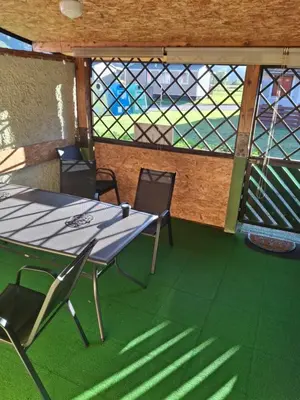 a table and chairs in a room with a window at Aca's & Lidija's Thermal Hideaway Čatež-Tickets included-min 2 nights in Brežice