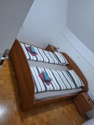 two beds with pillows on them in a room at Aca's & Lidija's Thermal Hideaway Čatež-Tickets included-min 2 nights in Brežice