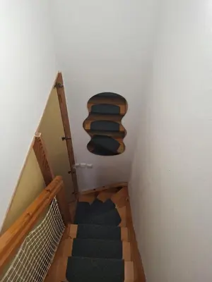 a stairway with a wooden shelf in a stair case at Aca's & Lidija's Thermal Hideaway Čatež-Tickets included-min 2 nights in Brežice