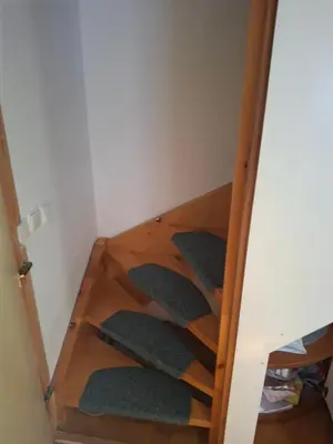 a stairway with green cushions in a room at Aca's & Lidija's Thermal Hideaway Čatež-Tickets included-min 2 nights in Brežice