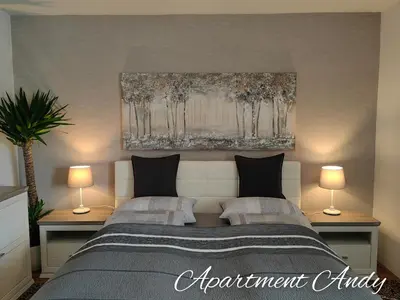 a bedroom with two beds and two lamps at Apartment Andy in Medvode