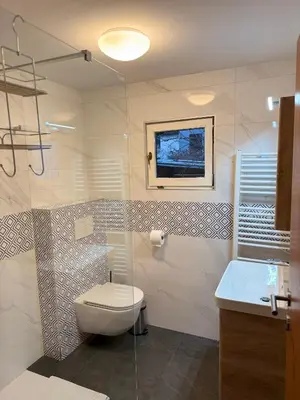 a bathroom with a toilet and a sink at Wooden Cabin in Ljubljana in Ljubljana
