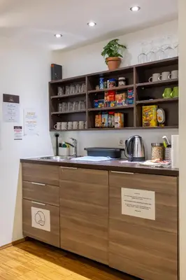 a kitchen with a sink and a counter at AMS Rooms in Ljubljana