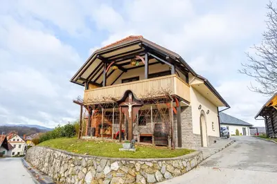 a building with a cross on a stone wall at Apartment Angelina in Metlika