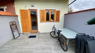 a bike parked next to a table on a patio at Villa Petz in Brežice
