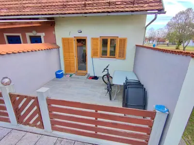 a house with a bike sitting on the front porch at Villa Petz in Brežice
