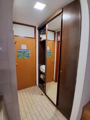 a hallway with a door and a mirror in a room at MATT Cozy Stay in Bovec