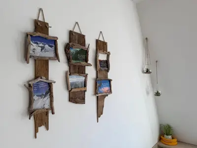 a bunch of pictures hanging on a wall at MATT Cozy Stay in Bovec