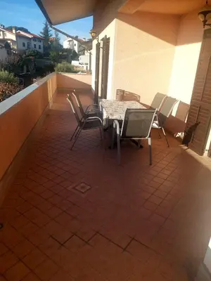 a patio with a table and chairs on a balcony at apartma Kiana in Šempeter pri Gorici
