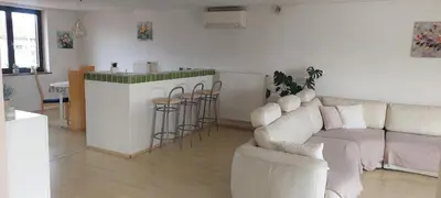 a living room with a couch and a bar at apartma Kiana in Šempeter pri Gorici