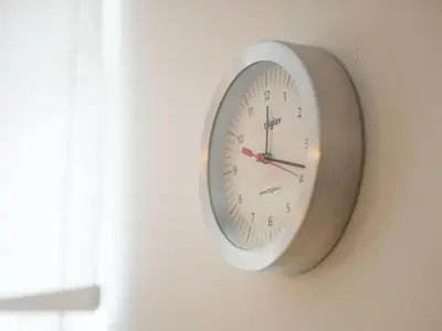 a clock is hanging on a wall at Apartment Appartement in Zasip mit Möblierter Terrasse by Interhome in Bled