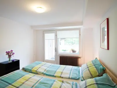 a bedroom with two beds and a window at Apartment Appartement in Zasip mit Möblierter Terrasse by Interhome in Bled