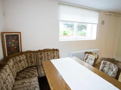 a dining room with a table and two chairs at Apartment Appartement in Zasip mit Möblierter Terrasse by Interhome in Bled