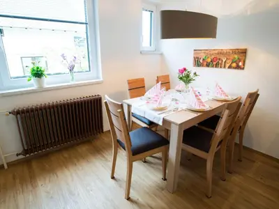 a dining room with a table and chairs at Apartment Tolle Ferienwohnung in Zasip mit Parkplatz by Interhome in Bled