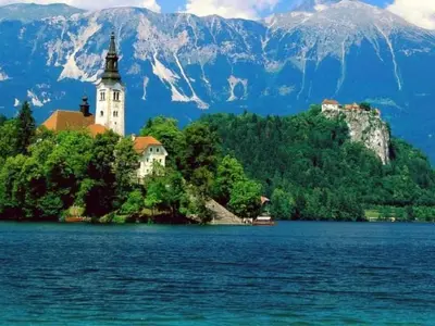 a church on an island in the middle of a lake at Apartment Tolle Ferienwohnung in Zasip mit Parkplatz by Interhome in Bled