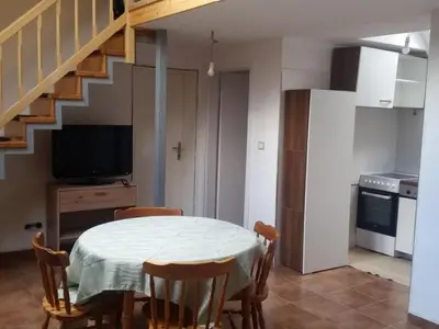 a kitchen and dining room with a table and chairs at Apartment für 4 Personen ca- 60 m² in Gozd- Krain - Innerkrain by Interhome in Gozd