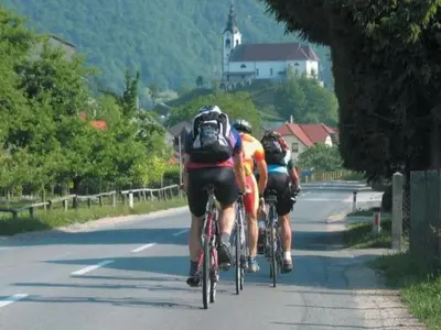 a group of people riding bikes down a road at Apartment Wohnung Rozika by Interhome in Slovenj Gradec
