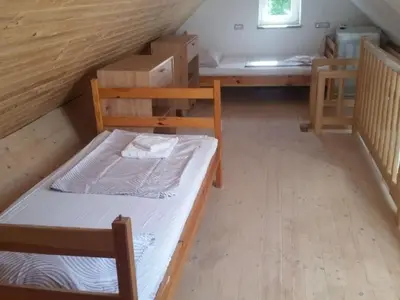 a room with two bunk beds in a attic at Apartment Studio für 4 Personen ca- 106 m² in Gozd- Krain - Innerkrain by Interhome in Gozd