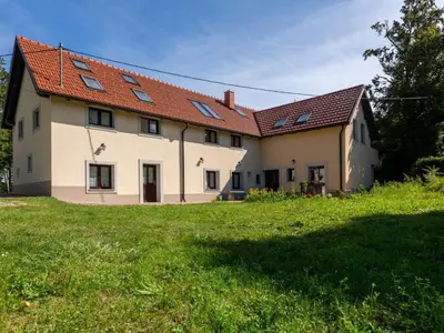 a house with solar panels on the roof at Apartment Studio für 4 Personen ca- 106 m² in Gozd- Krain - Innerkrain by Interhome in Gozd