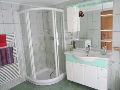 a bathroom with a shower and a sink at Holiday Home Geräumiges Ferienhaus inmitten der Natur by Interhome in Dolenja Trebuša