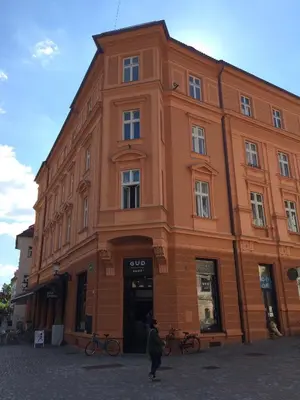 a person standing in front of a building at Apartment Loft in Ljubljana