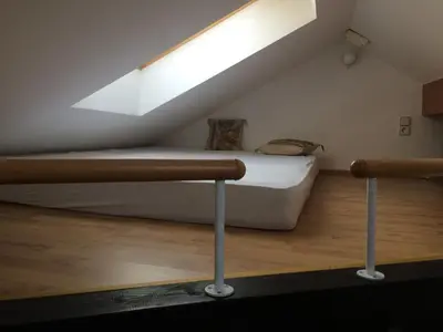 a bedroom with a bed and a skylight at Apartment Loft in Ljubljana