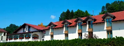 a building with a red roof at Guest House Gostišče Jutriša in Rogatec