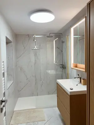 a bathroom with a shower and a sink at Emmas apartment with private parking and balcony in Ljubljana