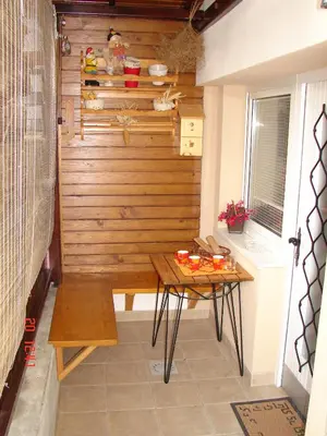 a small sauna with a wooden wall and a table at Apartma Žvan in Bled